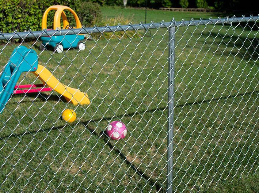 plastic-coated wire chain link fence is buried